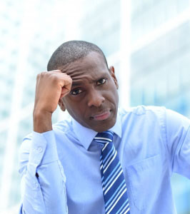 Man in suit, looking unhappy